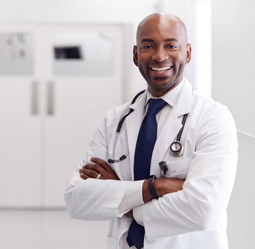 Male-varicose-veins-specialist-in-Las-Vegas-standing-with-his-hands-folded