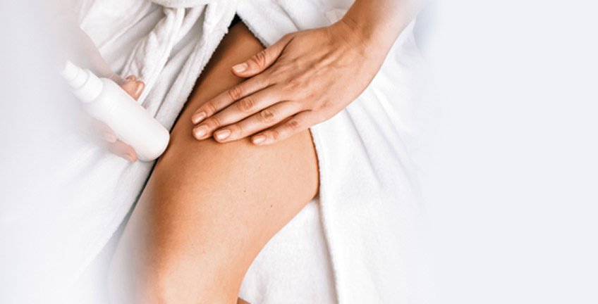 Woman-applying-cream-to-her-legs-after-spider-veins-removal-by-laser-in-Las-Vegas